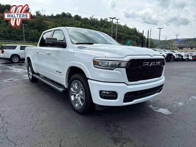2025 RAM 1500 Big Horn 4x4 Crew Cab 5'7" Box in White — front three-quarter view