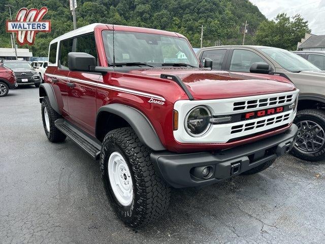 2026 Ford Bronco Heritage Edition 4 Door Advanced 4x4 in Ruby Red Metallic Tinted Clearcoat — front three-quarter view