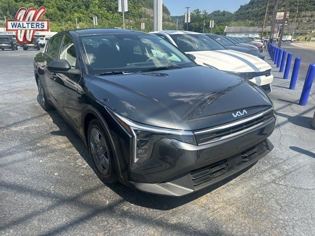 2026 Kia K4 LX Sedan in Interstellar Gray — front three-quarter view