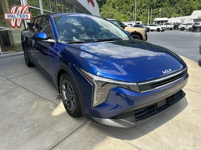 2026 Kia K4 LXS Sedan in Deep Sea Blue — front three-quarter view