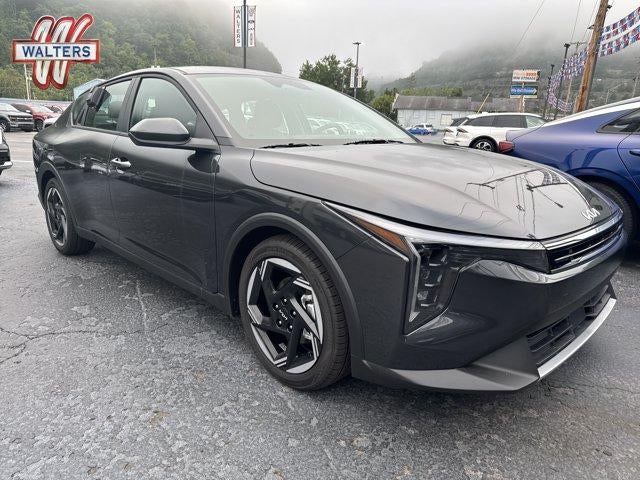 2026 Kia K4 EX Sedan in Interstellar Gray — front three-quarter view