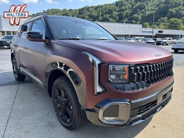 2027 Kia Seltos X-Line S AWD in Magma Red Matte — front three-quarter view