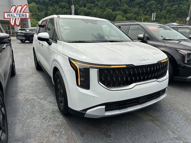 2026 Kia Carnival LX FWD in Snow White Pearl — front three-quarter view