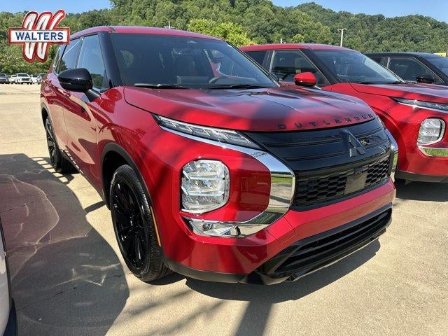 2026 Mitsubishi Outlander LE S-AWC in Red Diamond — front three-quarter view